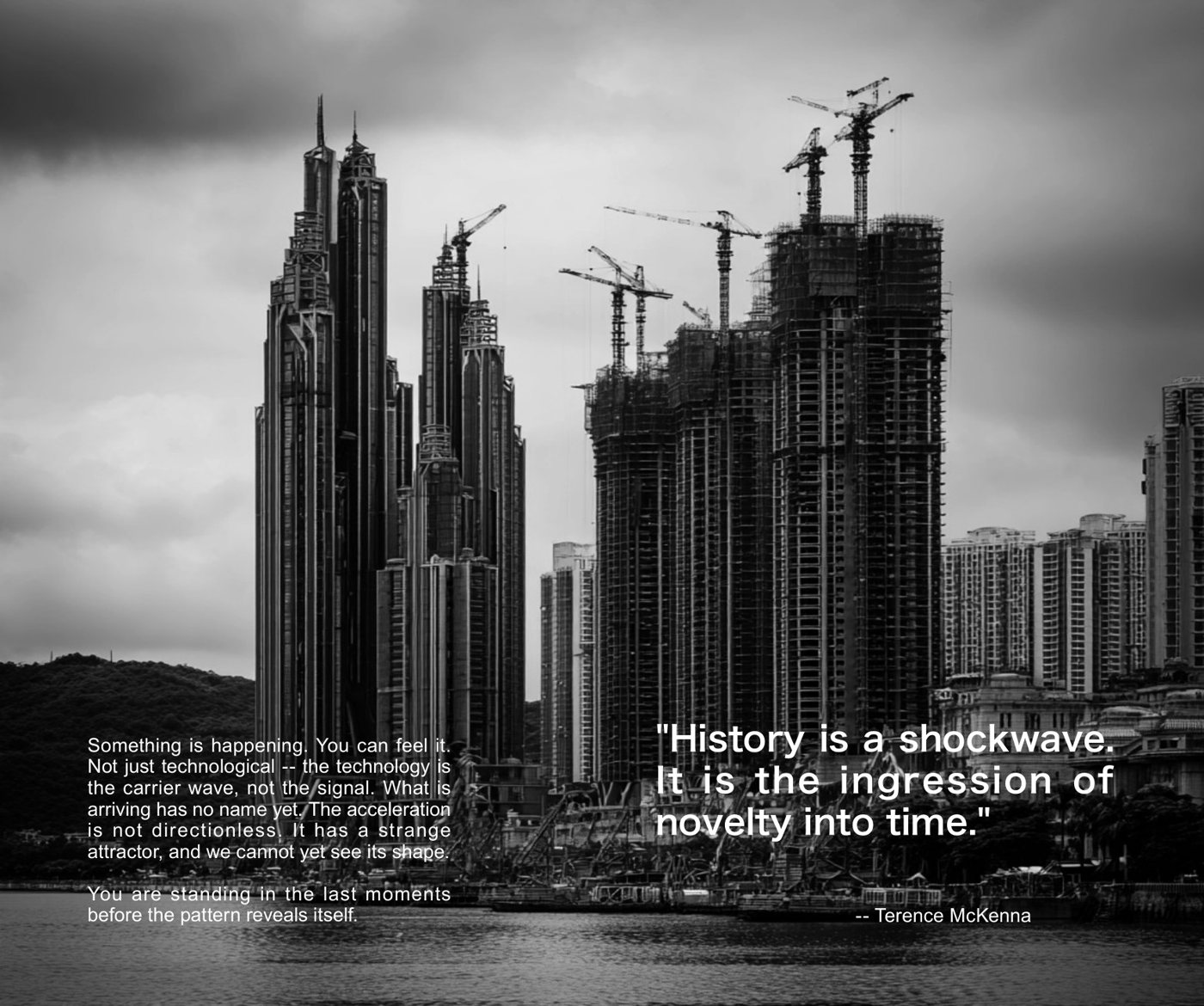 Spread from The Model is the Massage: towers under construction beneath a grey sky, with a Terence McKenna quotation